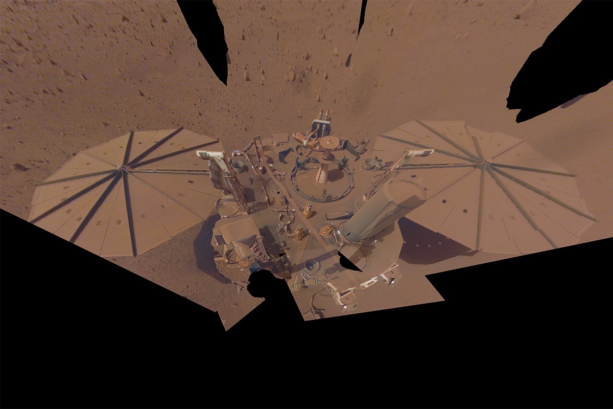 This image show's InSight's final selfie with dust-covered solar panels on April 24, 2022, or sol 1211.