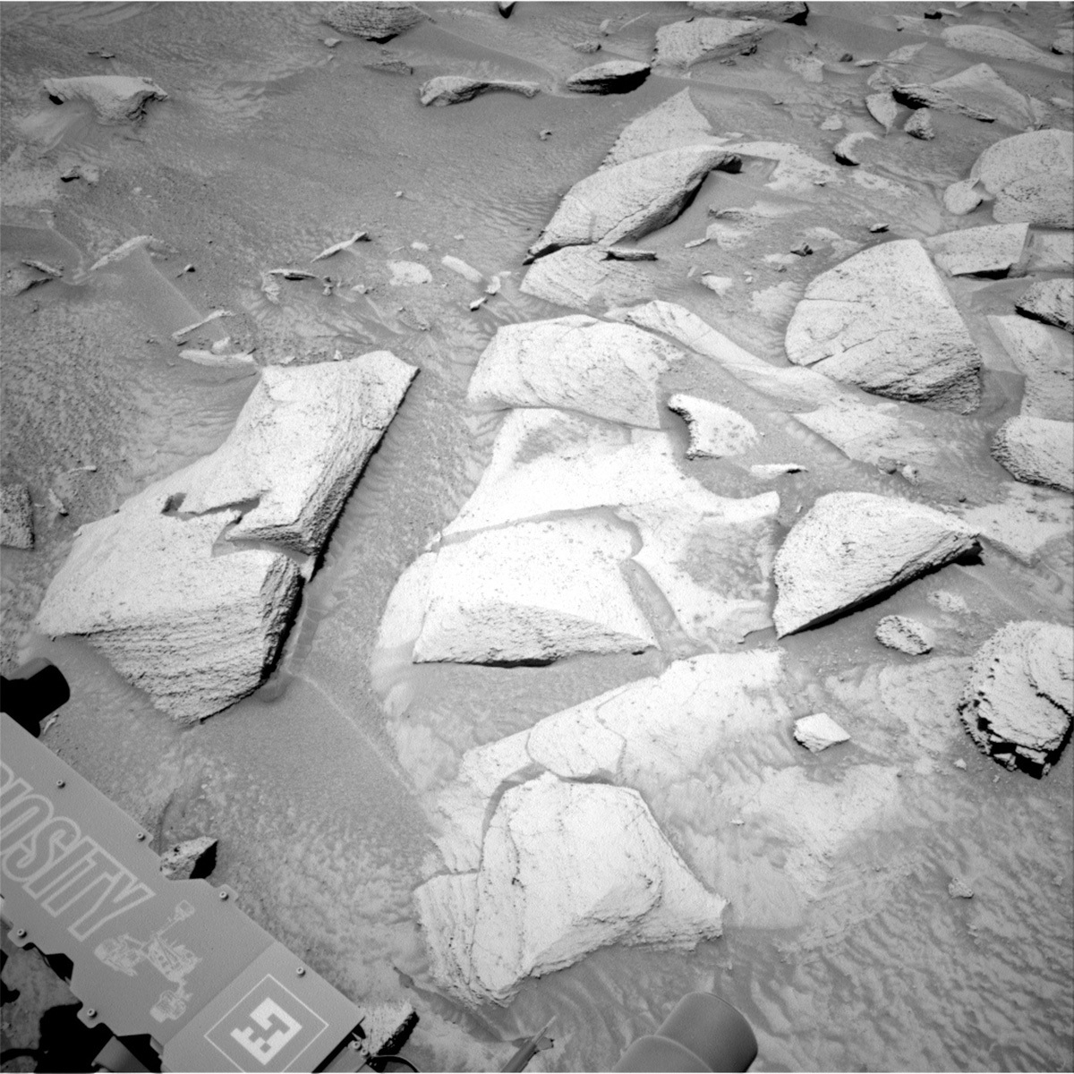 This image of Mars rocks and part of the Curiosity rover was taken by Right Navigation Camera onboard Curiosity on Sol 3817.