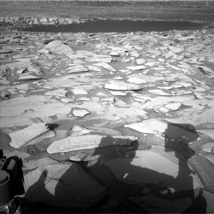 This image shows the shadow of the Curiosity rover on the Martian surface and was taken by Left Navigation Camera onboard Curiosity on Sol 3878.