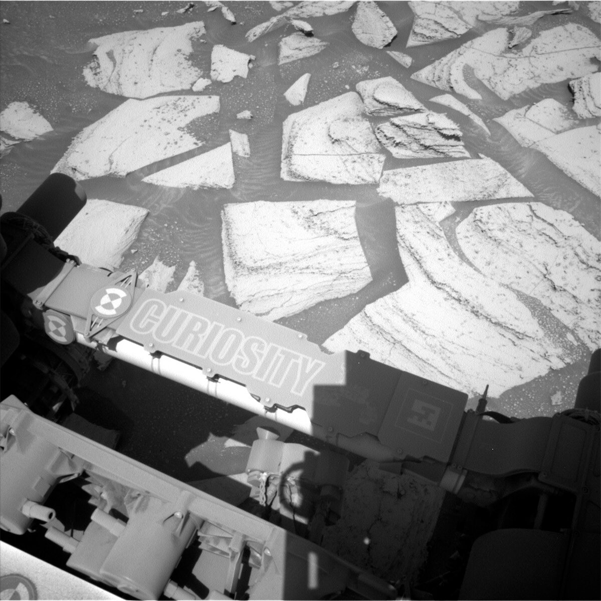 A Left Navcam image from sol 3974 showing off the nameplate on the rover’s arm and our next drill target “Sequoia” just right of centre.