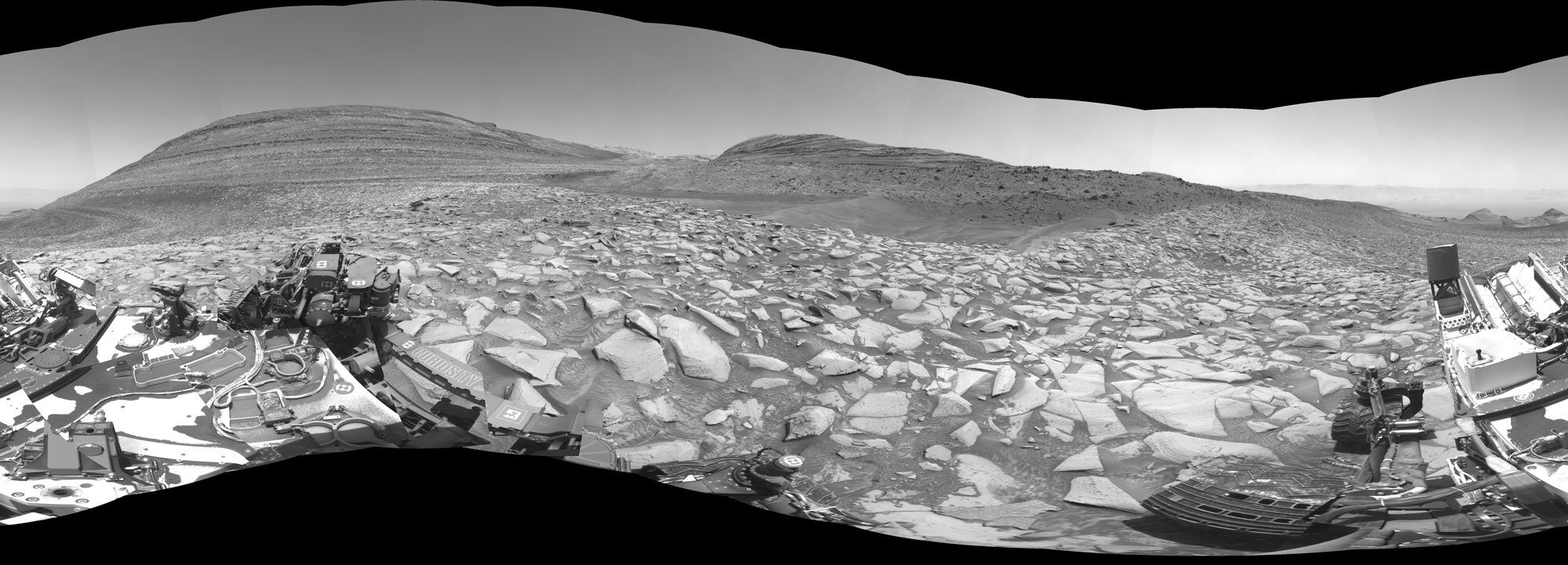 After arriving at Gediz Vallis channel, NASA’s Curiosity Mars rover captured this 360-degree panorama using one of its black-and-white navigation cameras on Feb. 3. The formation has scientists intrigued because of what it might tell them about the history of water on the Red Planet. 