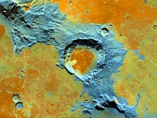On the southwest edge of the immense volcanic region of Tharsis, lava from its giant volcanoes flowed down to meet the old cratered landscape of Terra Sirenum.
