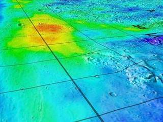 This image superimposes Gamma-Ray Spectrometer data from NASA's Mars Odyssey orbiter onto topographic data from the laser altimeter on NASA's Mars Global Surveyor.