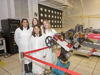 Clara Ma (in front) with Suparna Mukherjee, Julie Townsend, Jaime Waydo (in back row) are featured here in the laboratory where an engineering model of the next Mars rover, Curiosity, is being tested.