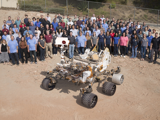 Many members of NASA's Mars Science Laboratory Project, which operates the Curiosity rover on Mars, gathered for this 2016 team photo with a test rover in the "Mars Yard" at NASA's Jet Propulsion Laboratory, Pasadena, California. 