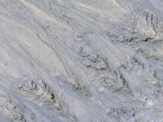 Seasonal Dark Streaks in Tivat Crater, Mars 