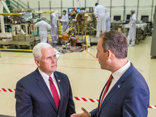 Vice President Mike Pence, left, speaks with Thomas Zurbuchen, NASA's associate administrator for the Science Mission Directorate, right, in a clean room facility near Denver, Colorado, where Lockheed Martin Space Systems is assembling and testing InSight, NASA's next spacecraft to Mars.