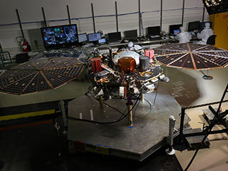 While in the landed configuration for the last time before arriving on Mars, NASA's InSight lander was commanded to deploy its solar arrays to test and verify the exact process that it will use on the surface of the Red Planet.