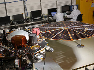 While in the landed configuration for the last time before arriving on Mars, NASA's InSight lander was commanded to deploy its solar arrays to test and verify the exact process that it will use on the surface of the Red Planet.