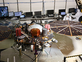While in the landed configuration for the last time before arriving on Mars, NASA's InSight lander was commanded to deploy its solar arrays to test and verify the exact process that it will use on the surface of the Red Planet.