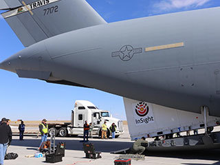 Personnel supporting NASA's InSight mission to Mars load the crated InSight spacecraft into a C-17 cargo aircraft at Buckley Air Force Base, Denver, for shipment to Vandenberg Air Force Base, California. The spacecraft, built in Colorado by Lockheed Martin Space, was shipped February 28, 2018, in preparation for launch from Vandenberg in May 2018.