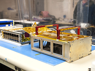 One of the MarCO CubeSats inside a cleanroom at Cal Poly San Luis Obispo, before being placed into its deployment box.