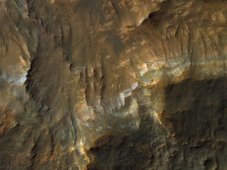 This color image from NASA's Mars Reconnaissance Orbiter (MRO) shows bedrock layers of diverse colors and composition.