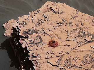 NASA's Curiosity rover successfully drilled a 2-inch-deep hole in a target called "Duluth" on May 20. It was the first rock sample captured by the drill since October 2016. This image was taken by Curiosity's Mast Camera (Mastcam) on Sol 2057.