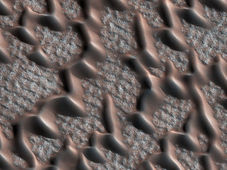 This image from NASA's Mars Reconnaissance Orbiter (MRO) shows the permanent polar cap of Mars, encircled by sand dunes and looking like pulled threads.