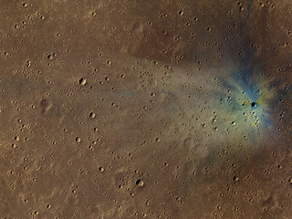 This is an image from NASA's Mars Reconnaissance Orbiter of a new impact site on Mars, within the dense secondary crater field of Corinto Crater.