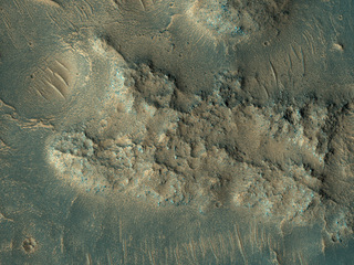 This image, acquired on May 13, 2018 by NASA's Mars Reconnaissance Orbiter, shows sand dunes scouring what appears to be a highly-cratered, old lava flow in the Tempe Terra region, located in the Northern Hemisphere.