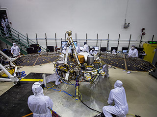Engineers at Lockheed Martin Space, Denver, Colorado, test the solar arrays on NASA's InSight lander several months before launch.