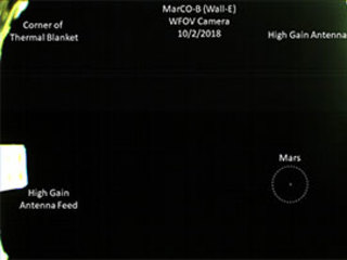 This annotated version of MarCO's first image of Mars details the thermal blanket, high gain antenna, and Mars.