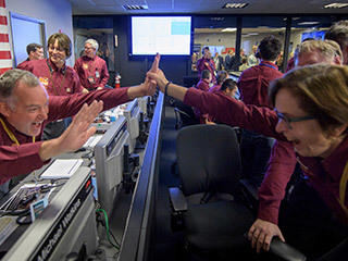 Tom Hoffman, InSight Project Manager, NASA JPL, left, and Sue Smrekar, InSight deputy principal investigator, NASA JPL, react after receiving confirmation that the Mars InSight lander successfully touched down on the surface of Mars, Monday, Nov. 26, 2018 inside the Mission Support Area at NASA's Jet Propulsion Laboratory in Pasadena, California. 