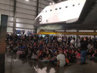 Visitors await news of InSight's landing during a viewing party at the California Science Center in Los Angeles, California on Nov. 26, 2018.