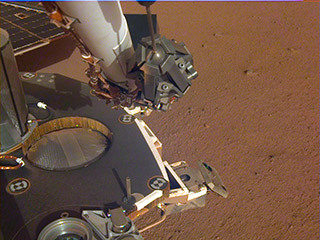 A partial view of the deck of NASA's InSight lander, where it stands on the Martian plains Elysium Planitia. The image was received on Dec. 4, 2018 (Sol 8).