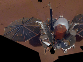 This is NASA InSight's first selfie on Mars. It displays the lander's solar panels and deck. On top of the deck are its science instruments, weather sensor booms and UHF antenna. 
