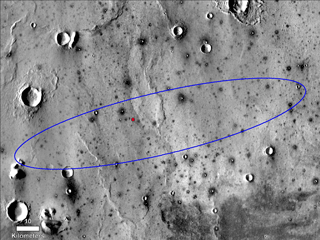 The red dot marks the final landing location of NASA's InSight lander in this annotated image of the surface of Mars, taken by the THEMIS camera on NASA's 2001 Mars Odyssey orbiter in 2015.