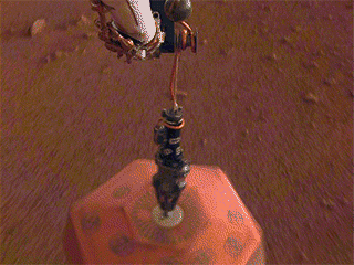 This set of images shows NASA's InSight lander deploying its first instrument onto the surface of Mars, completing a major mission milestone. 