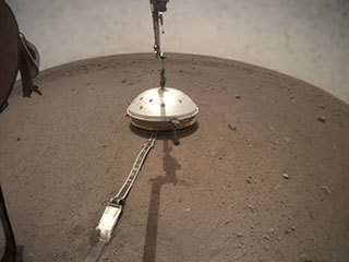 NASA's InSight lander deployed its Wind and Thermal Shield on Feb. 2 (Sol 66). The shield covers InSight's seismometer, which was set down onto the Martian surface on Dec. 19.