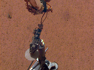 NASA's InSight lander set its heat probe, called the Heat and Physical Properties Package (HP3), on the Martian surface on Feb. 12.