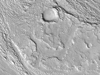 This image acquired on December 9, 2018 by NASAs Mars Reconnaissance Orbiter, shows Athabasca Valles with lava flows originating from Elysium Mons to the northwest.