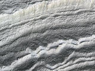 This image acquired on January 21, 2019 by NASAs Mars Reconnaissance Orbiter, shows the south polar layered deposits are well illuminated to accentuate the topography.