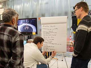 Bob Balaram, Teddy Tzanetos and Havard Grip from the NASA Mars Helicopter project discuss test results.