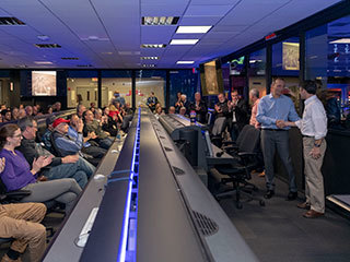 Scientists and engineers who worked on NASA’s Opportunity rover give mission leadership a round of applause in Mission Control at NASA’s Jet Propulsion Laboratory in Pasadena, California.