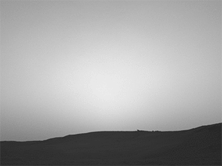 This series of images shows the shadow of Phobos as it sweeps over NASA's Curiosity Mars rover and darkens the sunlight on Monday, March 25, 2019 (Sol 2358).