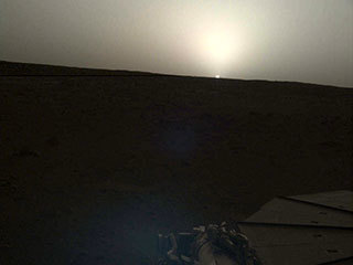 NASA's InSight lander used the Instrument Deployment Camera (IDC) on the end of its robotic arm to image this sunset on Mars on April 25, 2019, the 145th Martian day, or sol, of the mission. This was taken around 6:30 p.m. Mars local time.