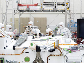 Mars 2020 engineers and technicians installed the high-gain antenna on the rover's equipment deck in the Spacecraft Assembly Facility's High Bay 1 clean room at JPL.