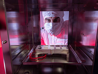 This calibration target for Mars 2020's SHERLOC instrument includes five samples of spacesuit material, the first to ever be flown to the Red Planet. By studying how these samples degrade in the Martian environment, engineers can develop better spacesuits.