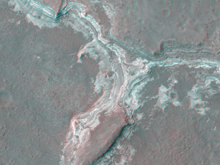 This image shows part of Ladon Vallis that is located within Ladon basin.