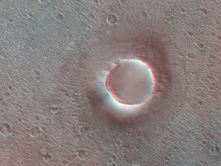 This HiRISE image shows a group of cones, shield-like features, and round mounds.