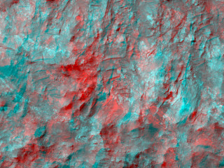 The enhanced-color subimage shows a great variety of colors and textures in the bedrock