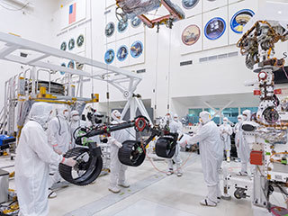 In this image, taken on June 13, 2019, engineers prepare the starboard legs and wheels — otherwise known as the mobility suspension — for integration onto NASA's Mars 2020 rover.
