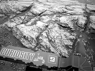 This image was taken by the left Navcam on NASA's Curiosity Mars rover on June 18, 2019, the 2,440th Martian day, or sol, of the mission. It shows part of "Teal Ridge," which the rover has been studying within a region called the "clay-bearing unit."