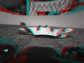 This image from the Mars Exploration Rover Spirit's rear hazard identification camera shows the rover's hind view of the lander platform, its nest for the past 12 sols