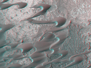 One of the very first places photographed by the MOC at the start of the Mapping Mission in March 1999 was a field of dunes located in Nili Patera, a volcanic depression in central Syrtis Major