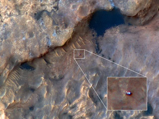 NASA's Curiosity Mars rover can be seen in this image taken from space by the HiRISE camera aboard the Mars Reconnaissance Orbiter.