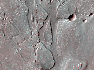 This large outflow channel shows many characteristic signs that massive amounts of water have flowed through this area, including the teardrop and streamlined islands.