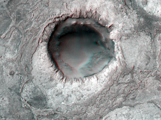 This image shows layered sedimentary rocks and ripples that fill and surround an impact crater in Meridiani Planum, an equatorial region where the rover Opportunity has been exploring the Martian surface since January 2004.