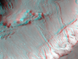 Shalbatana Vallis is a large channel with steep walls and a flat floor that may have formed by water draining from nearby Ganges Chasma.